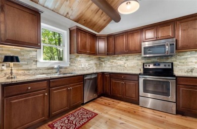 This is a light and bright, fully renovated, real log cabin in on Big Canoe Golf Club - Cherokee in Georgia - for sale on GolfHomes.com, golf home, golf lot