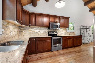 This is a light and bright, fully renovated, real log cabin in on Big Canoe Golf Club - Cherokee in Georgia - for sale on GolfHomes.com, golf home, golf lot