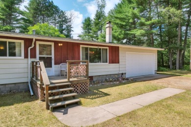 Explore a meticulously maintained 3-bedroom, 1.5-bathroom home on Plum Lake Golf Club in Wisconsin - for sale on GolfHomes.com, golf home, golf lot