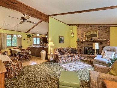 Explore a meticulously maintained 3-bedroom, 1.5-bathroom home on Plum Lake Golf Club in Wisconsin - for sale on GolfHomes.com, golf home, golf lot