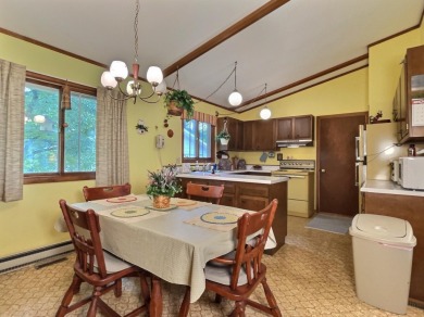 Explore a meticulously maintained 3-bedroom, 1.5-bathroom home on Plum Lake Golf Club in Wisconsin - for sale on GolfHomes.com, golf home, golf lot