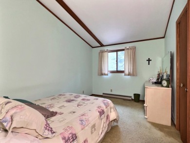 Explore a meticulously maintained 3-bedroom, 1.5-bathroom home on Plum Lake Golf Club in Wisconsin - for sale on GolfHomes.com, golf home, golf lot