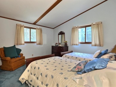 Explore a meticulously maintained 3-bedroom, 1.5-bathroom home on Plum Lake Golf Club in Wisconsin - for sale on GolfHomes.com, golf home, golf lot