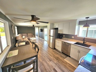 HUGE INCENTIVE, ALL LOT RENT WILL BE PAID THRU THE END OF THE on Riverbend Golf and Country Club in Florida - for sale on GolfHomes.com, golf home, golf lot