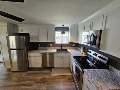 HUGE INCENTIVE, ALL LOT RENT WILL BE PAID THRU THE END OF THE on Riverbend Golf and Country Club in Florida - for sale on GolfHomes.com, golf home, golf lot