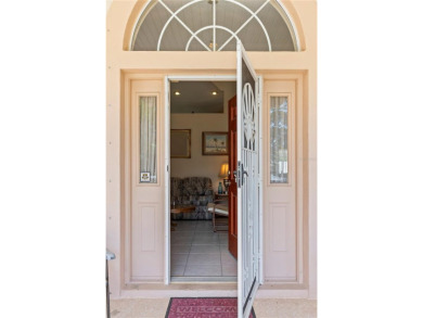 Welcome to this beautifully maintained 3 bedroom, 2 bath pool on The Grand Club Cypress Course in Florida - for sale on GolfHomes.com, golf home, golf lot