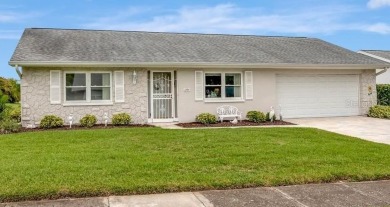 Stunning 2/2 home with a 2-car garage in a vibrant 55+ community on Highland Lakes Executive Golf Course in Florida - for sale on GolfHomes.com, golf home, golf lot