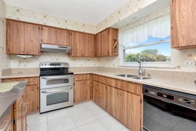 Stunning 2/2 home with a 2-car garage in a vibrant 55+ community on Highland Lakes Executive Golf Course in Florida - for sale on GolfHomes.com, golf home, golf lot
