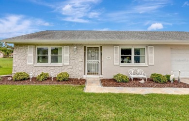 Stunning 2/2 home with a 2-car garage in a vibrant 55+ community on Highland Lakes Executive Golf Course in Florida - for sale on GolfHomes.com, golf home, golf lot