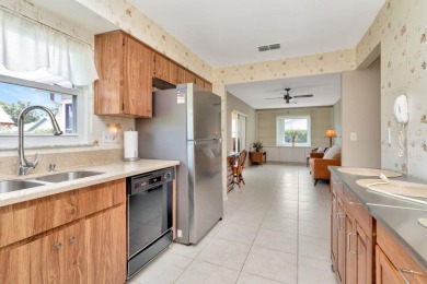 Stunning 2/2 home with a 2-car garage in a vibrant 55+ community on Highland Lakes Executive Golf Course in Florida - for sale on GolfHomes.com, golf home, golf lot