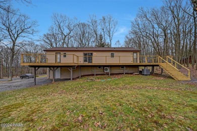 Welcome to your dream home nestled on a picturesque level lot on Paupack Hills Golf and Country Club in Pennsylvania - for sale on GolfHomes.com, golf home, golf lot