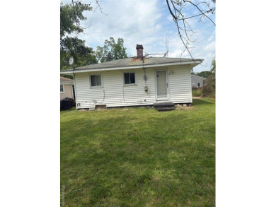 This charming and updated 2-bedroom, 1-bath ranch is move-in on The Links At Crystal Lake in Michigan - for sale on GolfHomes.com, golf home, golf lot