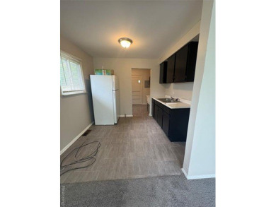 This charming and updated 2-bedroom, 1-bath ranch is move-in on The Links At Crystal Lake in Michigan - for sale on GolfHomes.com, golf home, golf lot