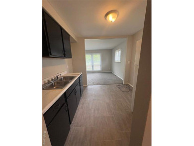 This charming and updated 2-bedroom, 1-bath ranch is move-in on The Links At Crystal Lake in Michigan - for sale on GolfHomes.com, golf home, golf lot