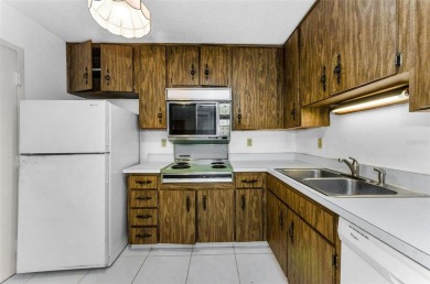 Location, location! Ground floor unit right by the pool & rec on The Dunedin Country Club in Florida - for sale on GolfHomes.com, golf home, golf lot