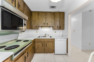 Location, location! Ground floor unit right by the pool & rec on The Dunedin Country Club in Florida - for sale on GolfHomes.com, golf home, golf lot