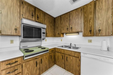 Location, location! Ground floor unit right by the pool & rec on The Dunedin Country Club in Florida - for sale on GolfHomes.com, golf home, golf lot