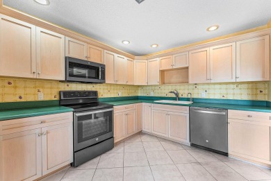 Experience timeless comfort and sweeping double fairway views in on Quail Ridge Golf Course and Country Club in Florida - for sale on GolfHomes.com, golf home, golf lot