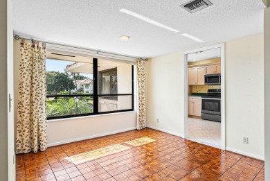 Experience timeless comfort and sweeping double fairway views in on Quail Ridge Golf Course and Country Club in Florida - for sale on GolfHomes.com, golf home, golf lot