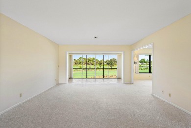 Experience timeless comfort and sweeping double fairway views in on Quail Ridge Golf Course and Country Club in Florida - for sale on GolfHomes.com, golf home, golf lot