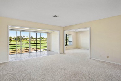 Experience timeless comfort and sweeping double fairway views in on Quail Ridge Golf Course and Country Club in Florida - for sale on GolfHomes.com, golf home, golf lot