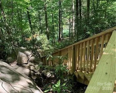 Private, LAKEFRONT LOT on beautiful Lake Lure! Located in on Rumbling Bald Resort on Lake Lure in North Carolina - for sale on GolfHomes.com, golf home, golf lot