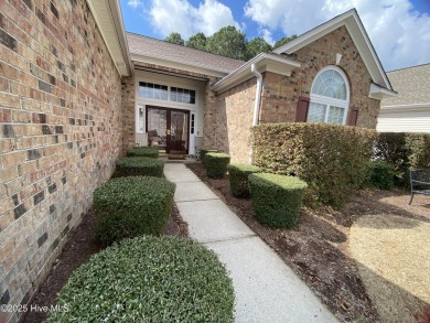 Looking for the home with a 3-car garage, water views, and golf on Sandpiper Bay Golf and Country Club in North Carolina - for sale on GolfHomes.com, golf home, golf lot