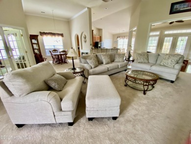 Looking for the home with a 3-car garage, water views, and golf on Sandpiper Bay Golf and Country Club in North Carolina - for sale on GolfHomes.com, golf home, golf lot