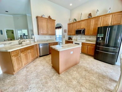 Looking for the home with a 3-car garage, water views, and golf on Sandpiper Bay Golf and Country Club in North Carolina - for sale on GolfHomes.com, golf home, golf lot