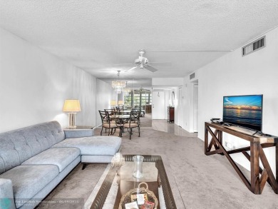 Spacious & move-in ready updated 2 BR/2BA condo on the 2nd floor on Palm-Aire Country Club and Resort - Palms in Florida - for sale on GolfHomes.com, golf home, golf lot