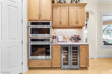 Immerse yourself in this exceptional furnished residence in on Fiddlesticks Country Club in Florida - for sale on GolfHomes.com, golf home, golf lot