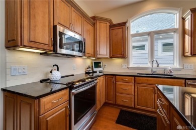 Experience refined living in this exceptional Dunnington custom on The Golf Club At Yankee Trace in Ohio - for sale on GolfHomes.com, golf home, golf lot