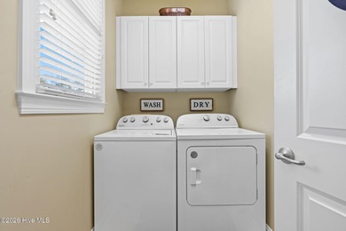 Get ready to fall in love with this luxurious townhome and the on Rivers Edge Golf Club in North Carolina - for sale on GolfHomes.com, golf home, golf lot