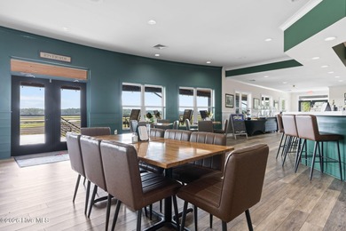 Get ready to fall in love with this luxurious townhome and the on Rivers Edge Golf Club in North Carolina - for sale on GolfHomes.com, golf home, golf lot