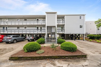 Escape to your own one-bedroom condo in a peaceful resort-style on Harbour Point Golf Club in North Carolina - for sale on GolfHomes.com, golf home, golf lot
