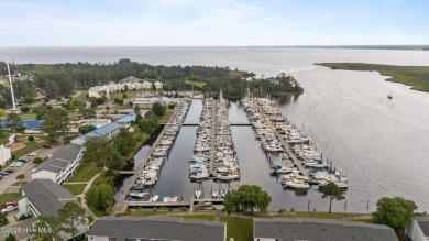 Escape to your own one-bedroom condo in a peaceful resort-style on Harbour Point Golf Club in North Carolina - for sale on GolfHomes.com, golf home, golf lot