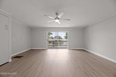 Escape to your own one-bedroom condo in a peaceful resort-style on Harbour Point Golf Club in North Carolina - for sale on GolfHomes.com, golf home, golf lot