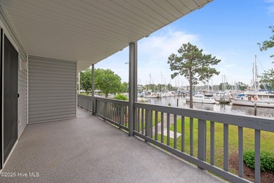 Escape to your own one-bedroom condo in a peaceful resort-style on Harbour Point Golf Club in North Carolina - for sale on GolfHomes.com, golf home, golf lot