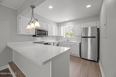 Escape to your own one-bedroom condo in a peaceful resort-style on Harbour Point Golf Club in North Carolina - for sale on GolfHomes.com, golf home, golf lot