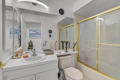 Three bedrooms, a private pool, and lake and golf course on Peridia Golf and Country Club in Florida - for sale on GolfHomes.com, golf home, golf lot