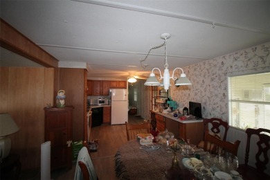 Wonderful and well-maintained mobile home with 3 bedrooms/1.5 on Betmar Acres Golf Club in Florida - for sale on GolfHomes.com, golf home, golf lot