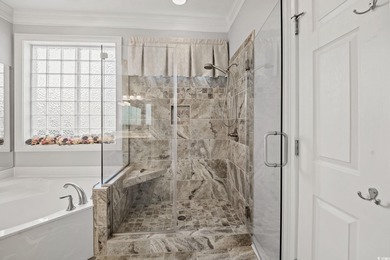 Elegant all-brick golf-front living with sweeping 9th-fairway on International Club of Myrtle Beach in South Carolina - for sale on GolfHomes.com, golf home, golf lot