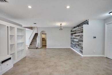 Located on a quiet, tree-lined street and surrounded by lush on The Links At Madison Green in Florida - for sale on GolfHomes.com, golf home, golf lot