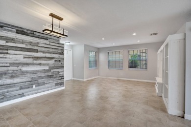 Located on a quiet, tree-lined street and surrounded by lush on The Links At Madison Green in Florida - for sale on GolfHomes.com, golf home, golf lot