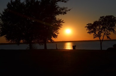 ABSOLUTELY BREATHTAKING VIEWS AND SUNSETS FROM THIS BEAUTIFUL on Cedar Creek Country Club in Texas - for sale on GolfHomes.com, golf home, golf lot