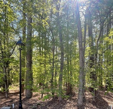 This beautiful wooded lot is located on a quiet cul-de-sac and on Fords Colony Country Club in Virginia - for sale on GolfHomes.com, golf home, golf lot