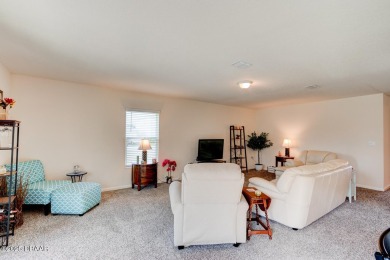 Discover this stunning lake-view home on a spacious corner lot! on Grand Reserve Golf Course in Florida - for sale on GolfHomes.com, golf home, golf lot
