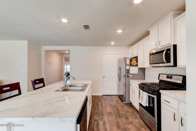 Discover this stunning lake-view home on a spacious corner lot! on Grand Reserve Golf Course in Florida - for sale on GolfHomes.com, golf home, golf lot