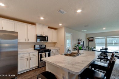 Discover this stunning lake-view home on a spacious corner lot! on Grand Reserve Golf Course in Florida - for sale on GolfHomes.com, golf home, golf lot