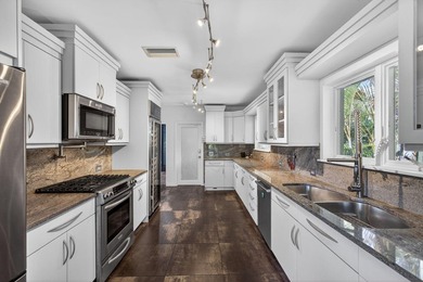 The owners are downsizing, creating a rare opportunity to own on Lake Worth Municipal Golf Course in Florida - for sale on GolfHomes.com, golf home, golf lot